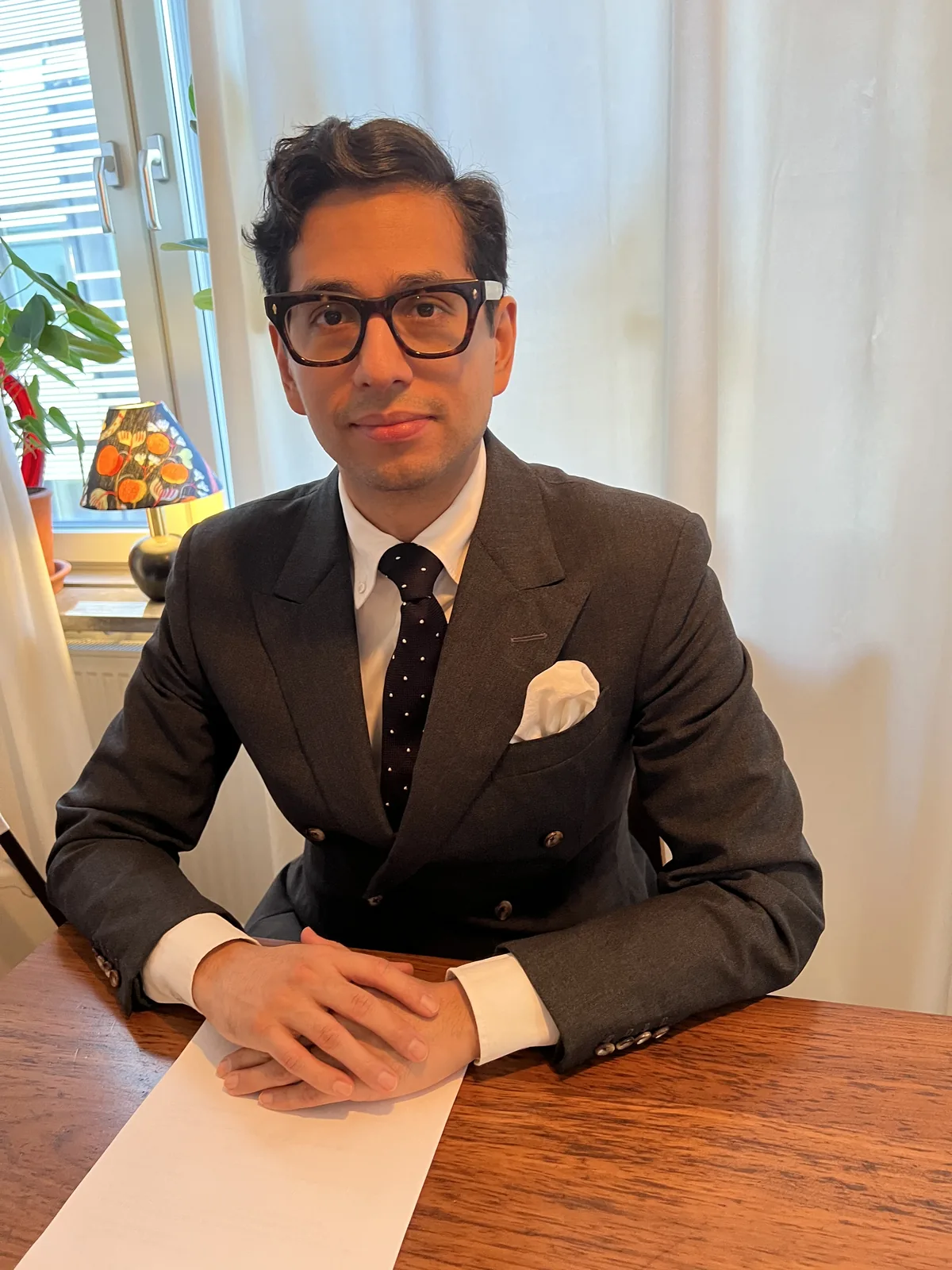 Simon Dicksved seated at a table